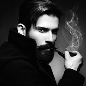 Black and white portrait of hipster man smoking